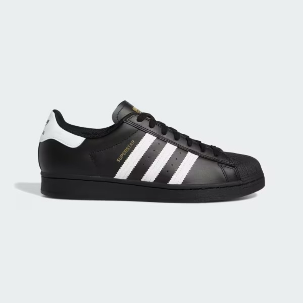 Adidas Black and White Sneakers with Gold Accents